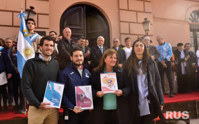 RUS junto a la llama olímpica